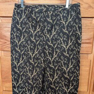 Ann Klein black cotton sateen pants size 12 with sprays of golden flowers.